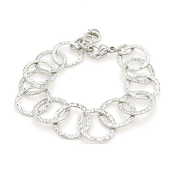 Rainbow silver bracelet with circus motifs.