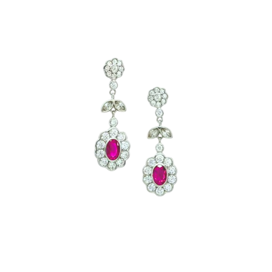 Silver earrings with red circuses.