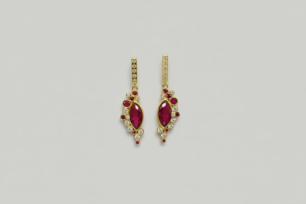 Silver earrings with red circuses.