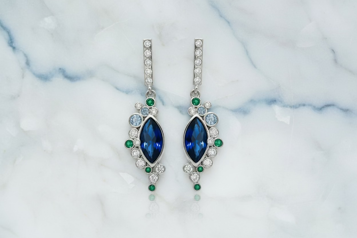 Silver earrings with blue circus stones.