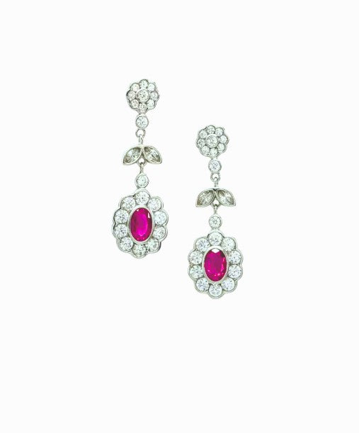 Silver earrings with red circuses.